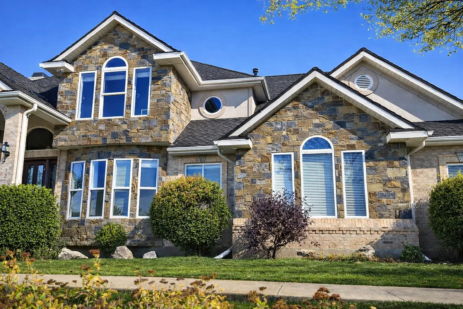 Home Exterior showing new masonry or remodel work tied into the home’s exterior style.